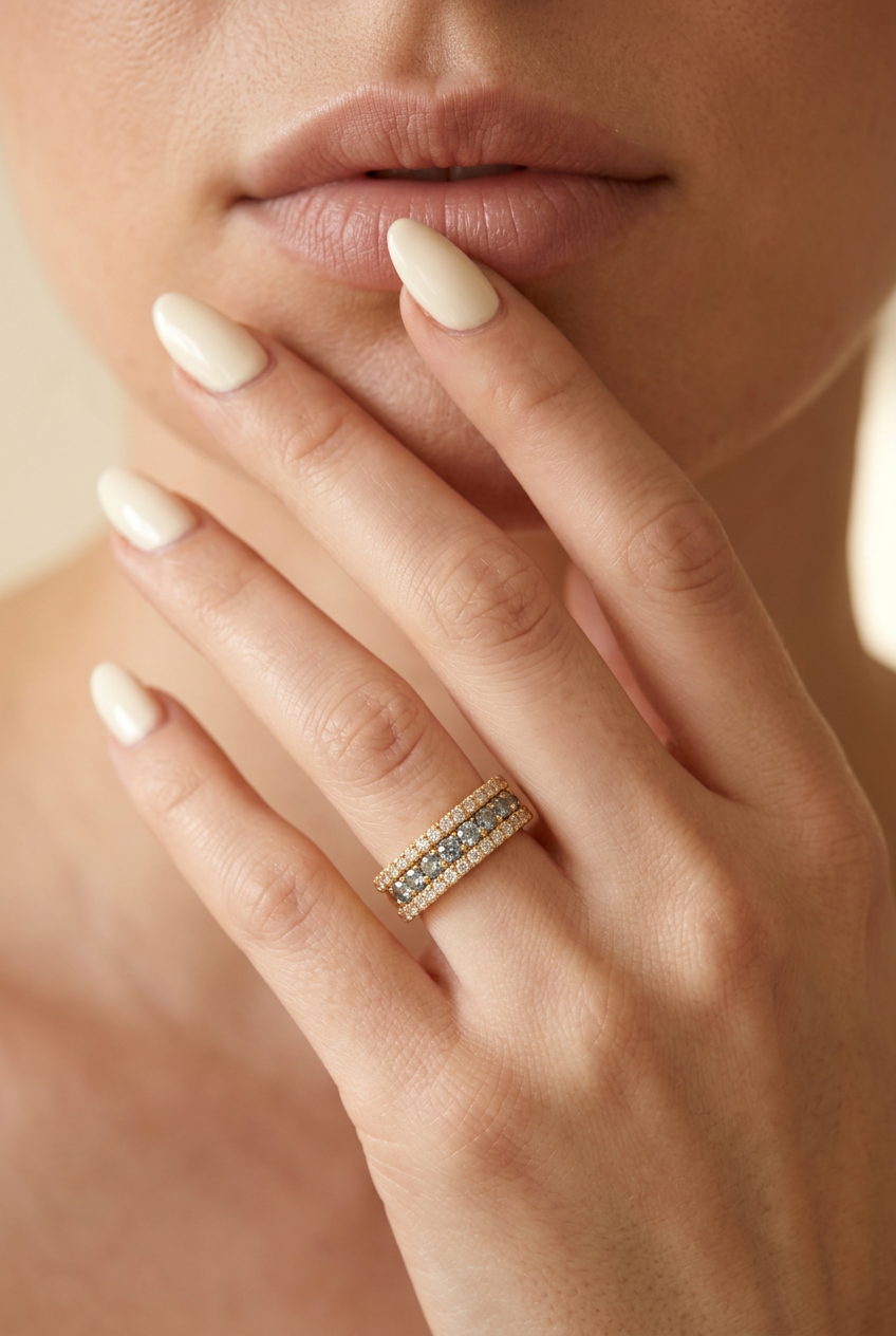 Hand gently touching lips with the rest of the model’s face cropped out